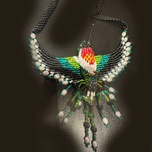Hand beaded hummingbird necklace. 28".  Multicolor. Enhanced with pearl beads.